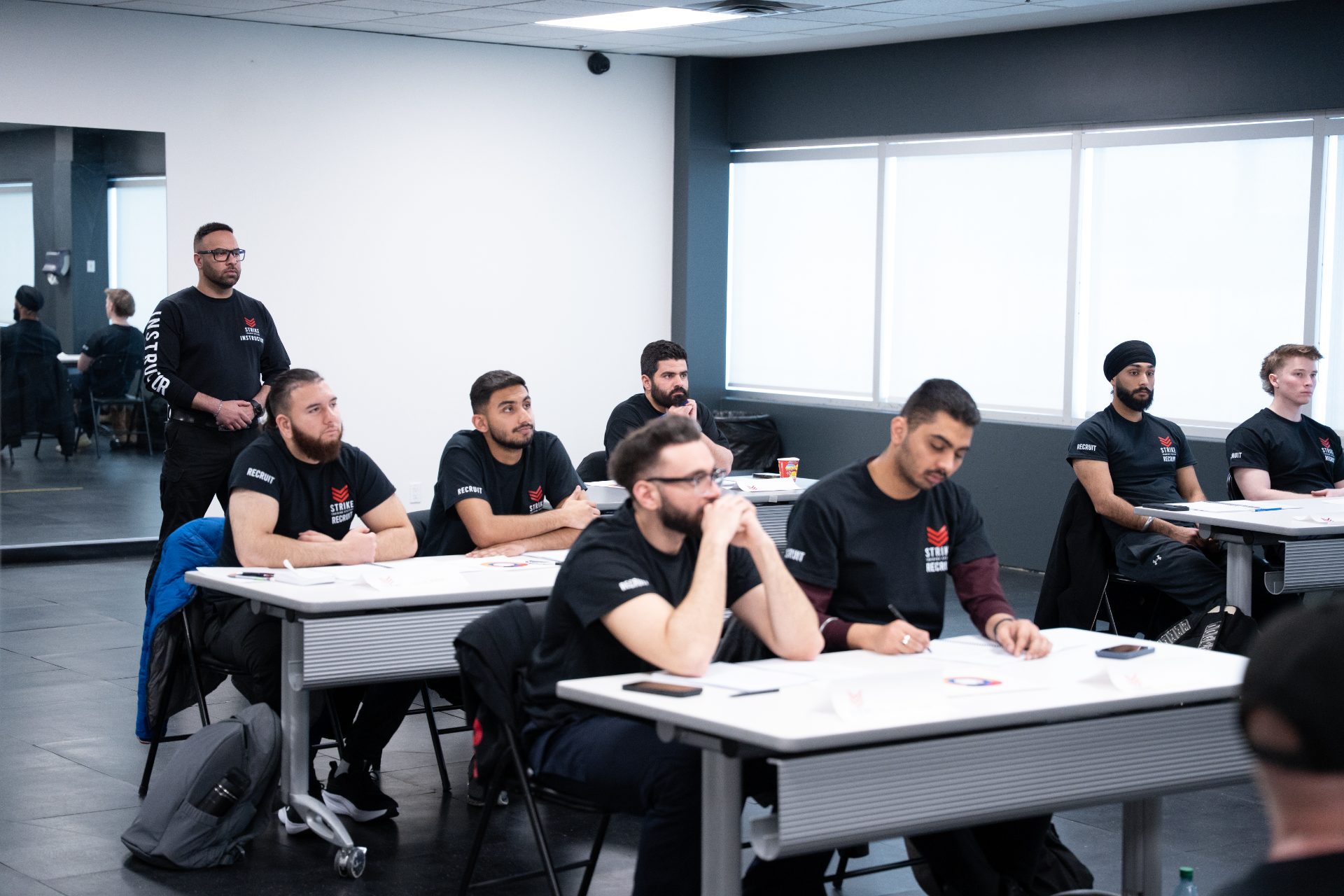 strike-training-systems-calgary-defensive-tactics-recruits-classroom-study-01-Calgary