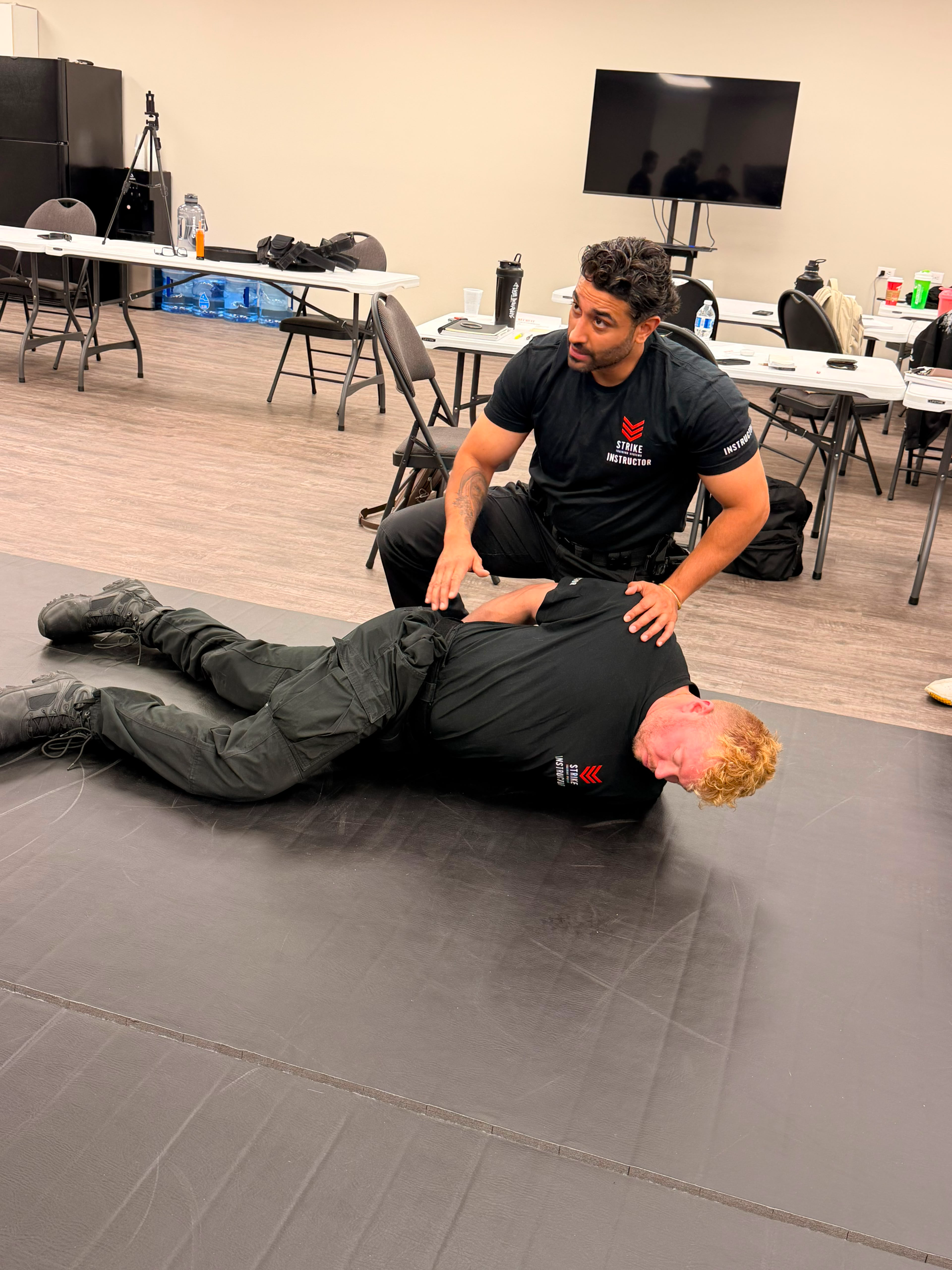 strike-training-systems-calgary-instructor-ground-control-prone-restraint-02-Calgary