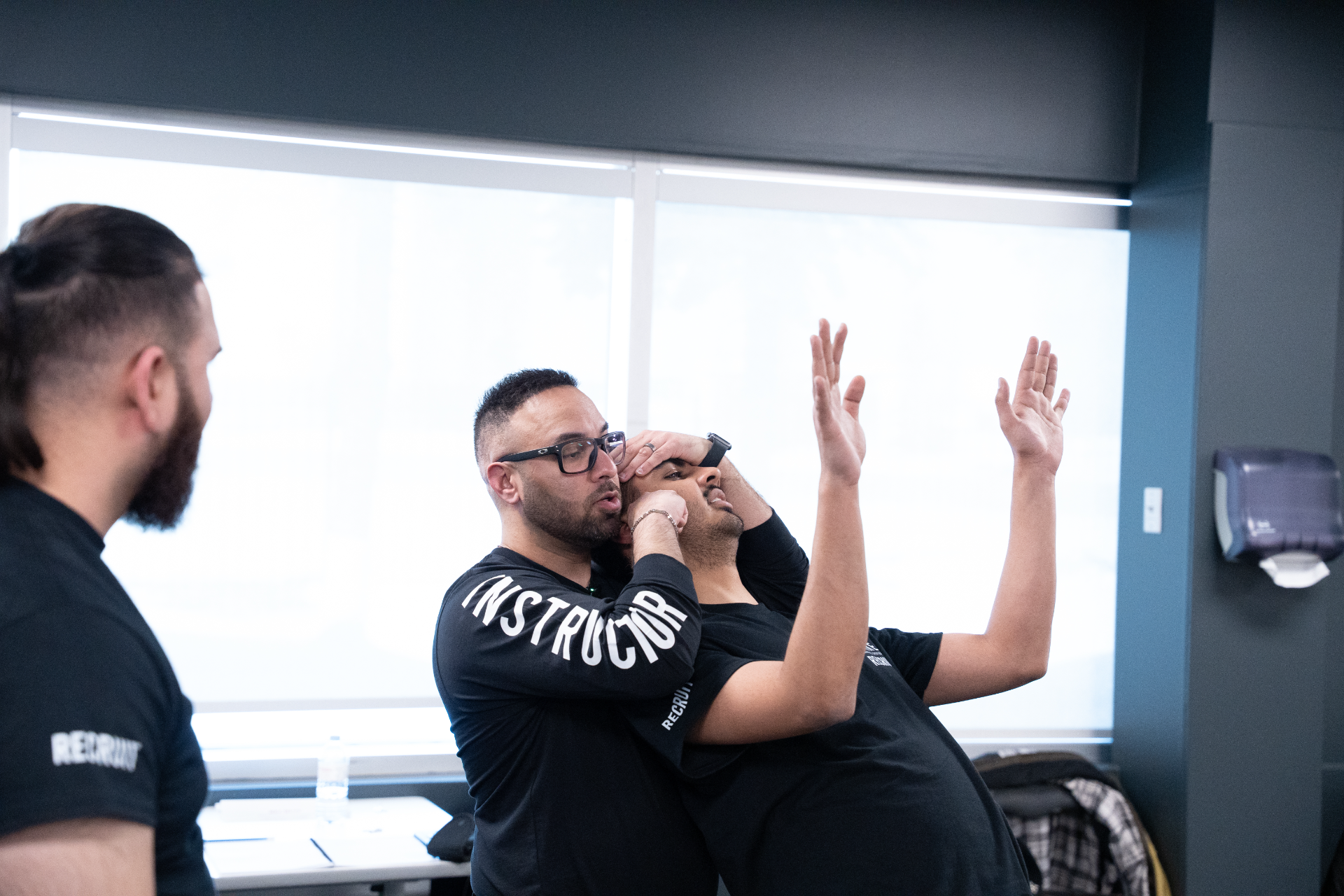 strike-training-systems-calgary-instructor-head-control-takedown-demo-01-Calgary