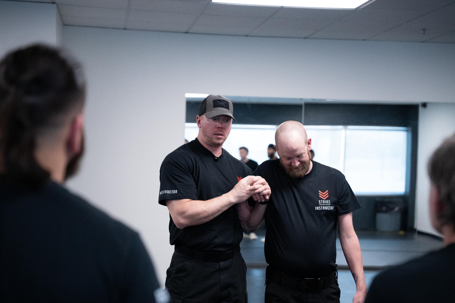 strike-training-systems-calgary-instructor-wristlock-joint-control-demo-01-Calgary