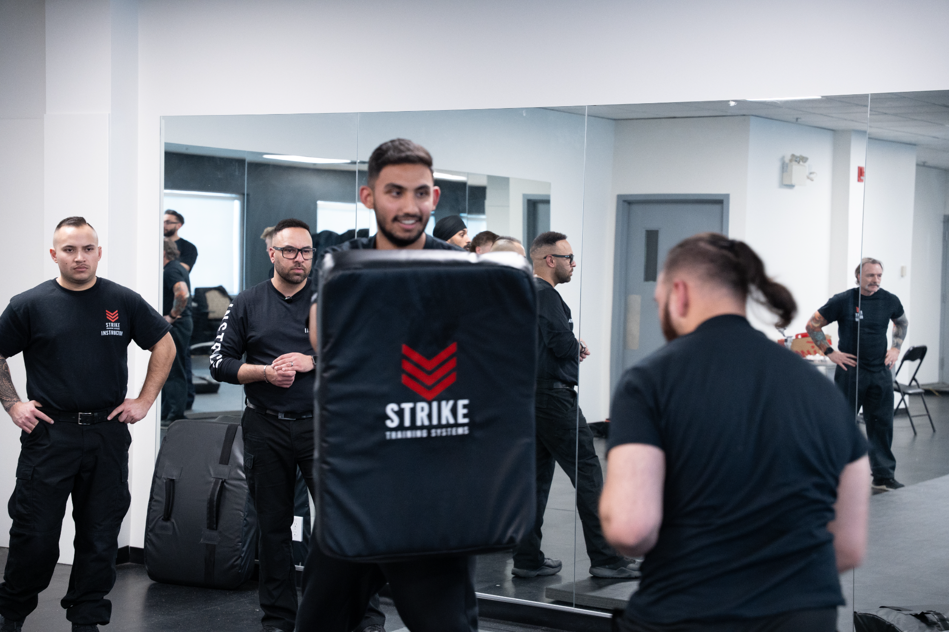 strike-training-systems-calgary-shield-pad-drill-use-of-force-training-01-Calgary